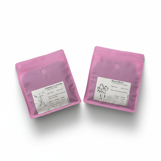 Two pink coffee bags with labels on a white surface, coffee deal