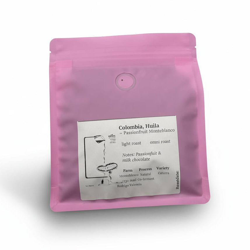 Pink coffee packaging with a label on a white background. Passionfruit coffee